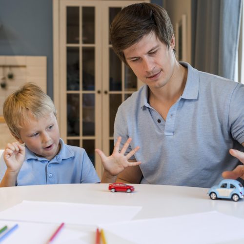 father-playing-with-his-adorable-son